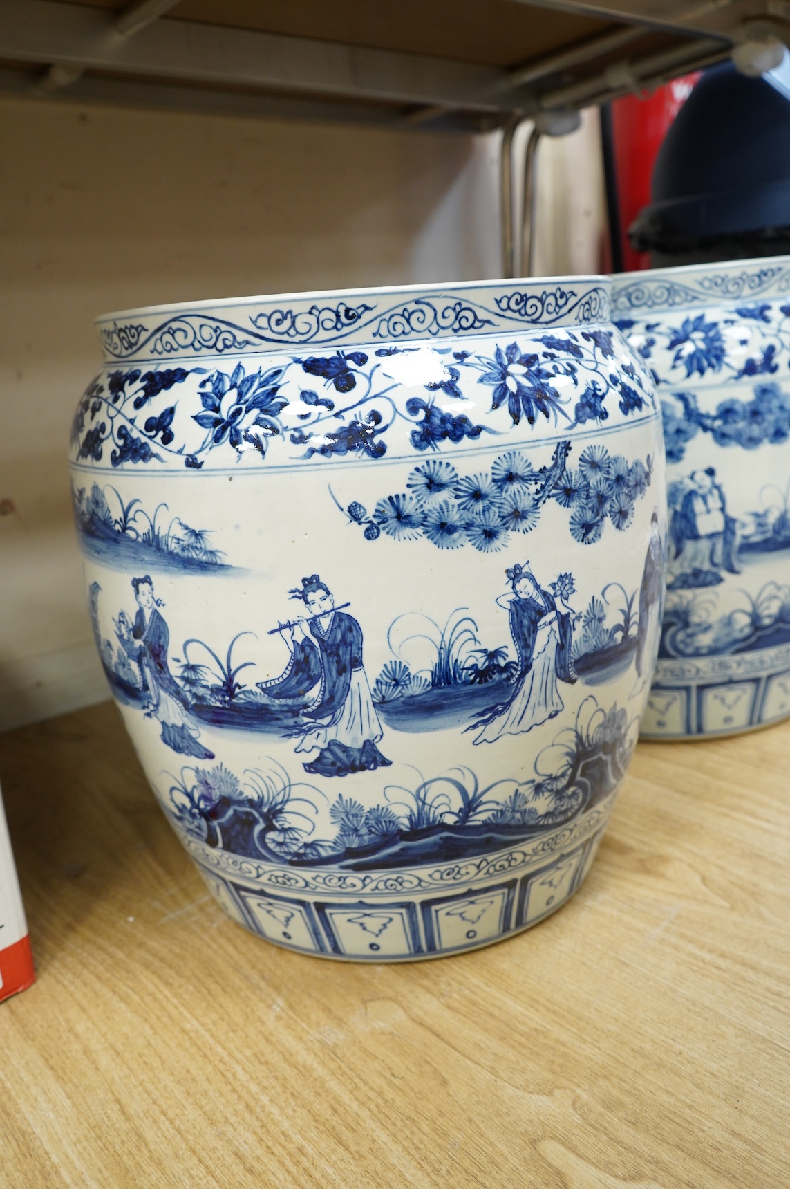 A large pair of Chinese blue and white planters, 43cm high.